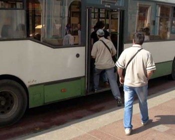 street crime in St. Petersburg, Russia. Always in motion, the pickpocket pair hops a bus only to get off at the next stop and walk back.