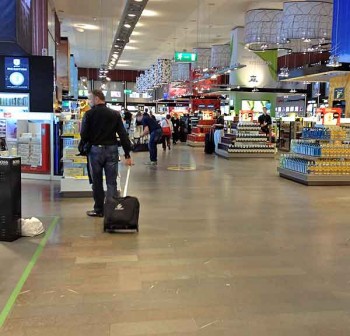 Stockholm airport Arlanda shopping: Forced to walk through the whole store because the handy exit at left is blocked with trolleys.