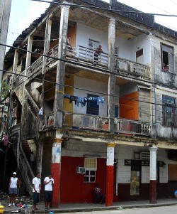 Across the street from our interview, another decaying building alive with people.