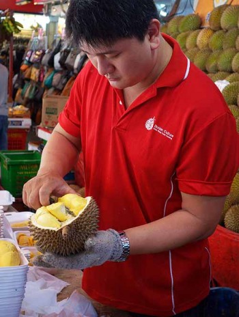 The durian men in Singapore cut, grade, and sort the fruit all day.