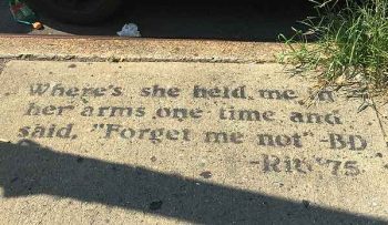 Bob Dylan on the sidewalk; bike stripped by thieves