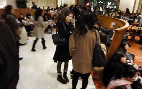 Lobby of The Peninsula is crowded with stranded workers.