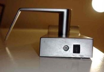 Electronic access points on the underside of a keycard lock.