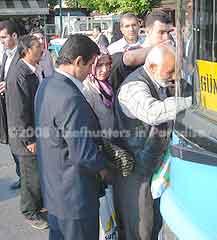 Istanbul pickpockets: "Pinstripe" works while "Teach," in the background, looks into our camera.