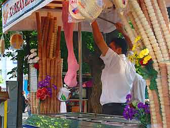 Istanbul pickpockets: In Istanbul, a sidewalk vendor works his pink ice cream.