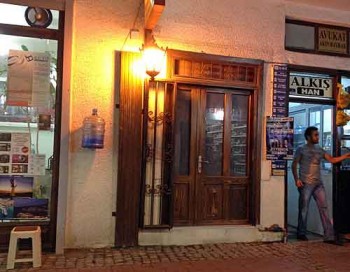 Turkish counterfeits: The mysterious door opposite our restaurant, and the water bottle that got our attention.