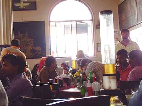 Eating Mumbai: Beer is served in tall, iced dispensers at Leopold's the famous cafe that was bombed in 2008.