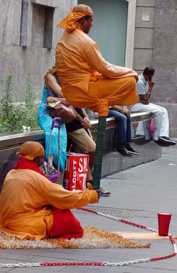 Living statue street performers levitate