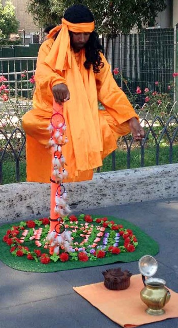 Living statue street performers levitate