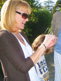 How to catch a lizard. Naomi strips a stalk of rye grass.