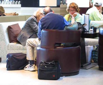 A bag completely out of its owner's site in a hotel lobby.