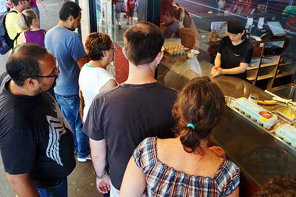 Mamak window showcases the making of roti.