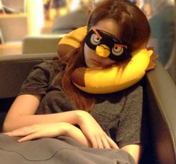 Masked traveler in a lounge in Istanbul airport