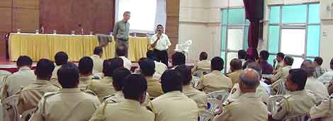 Street crime in Mumbai, India: At Bob Arno's seminar at the Azad Maiden Police Station, video was projected onto a sheet taped to the wall.