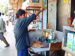 Mixing the masala chai as it steeps.