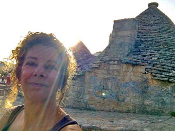 In front of a really old trullo in Alberobello, Italy.