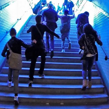 Paris pickpockets: Skipping and singing, the pickpockets lead us out of the subway and into Place Pigalle, a safe place to talk.