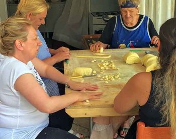 In Bari, Italy, women drag tables into shady alleys and sunny squares to make their specialty pasta, orecchiette, in many sizes and colors.