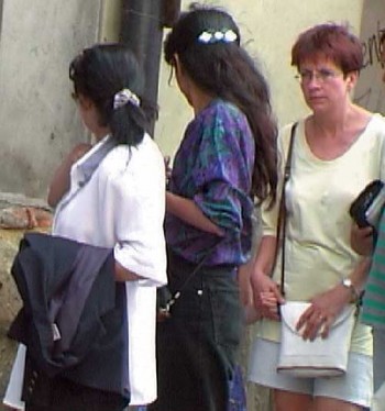 Two pickpockets in Prague look back at their angry intended victim.