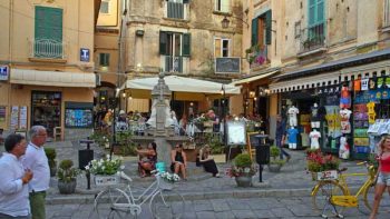 Piazza Tre Fontane. 
Residenza il Barone's apartment is above the restaurant umbrella, at top center, on the second and third floors.