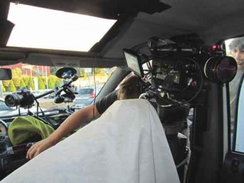 Light panels are mounted on the taxi ceiling and backseat windows. White reflecting fabric helps brighten the scene. It's dark before we get moving.