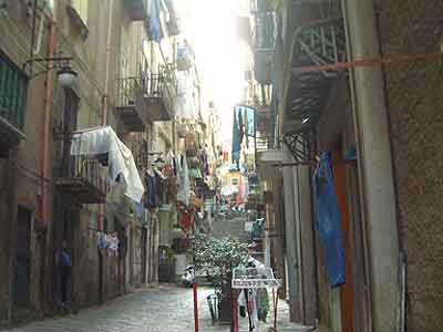 Balconies, laundry, and steep stairs personify the quarter as much as crime.