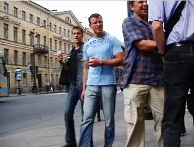 Four pickpockets in Russia greet Bob, whose back is to the camera.