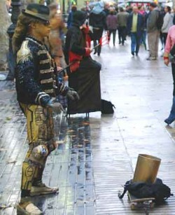 People walk right past living statue Michael Jacksonesque, who was previously compelling with music and motion.