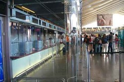 A new glass enclosure keeps the crowds away from travelers as they buy their tickets. Still, station police get about 50 reports of theft per day.