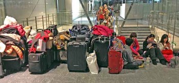 Tokyo Narita airport: Delayed travelers whose flights had been cancelled could not even check in.