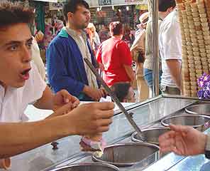 Istanbul pickpockets: The vendor has fun with customers, but no worry: the ice cream is thick and won't melt.