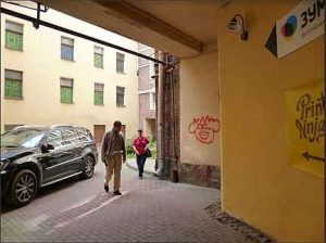 Grafitti-covered entrance to the flat's courtyard.